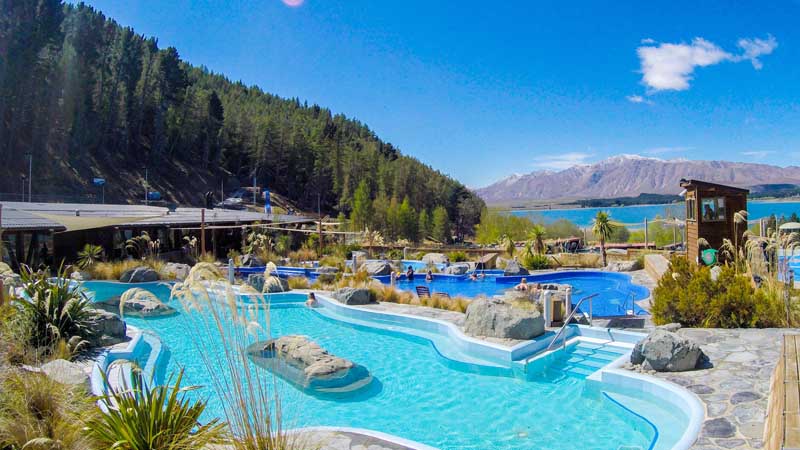 Relax in the stunning hot pools at Tekapo Springs, overlooking the Lake and Two Thumb Mountain range.